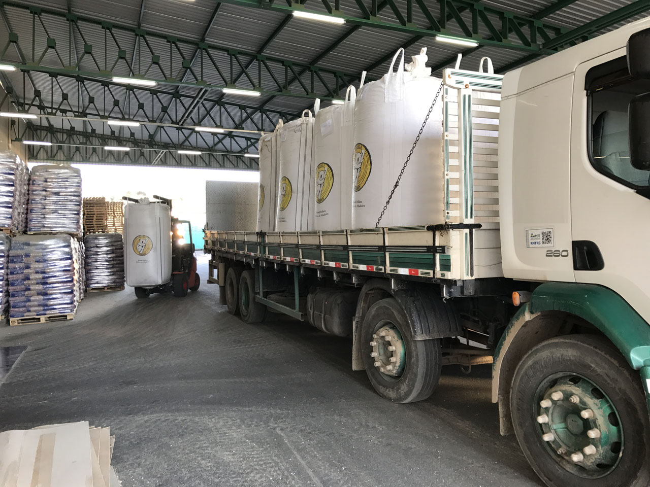 White batch goods loaded on a truck inside the warehouse